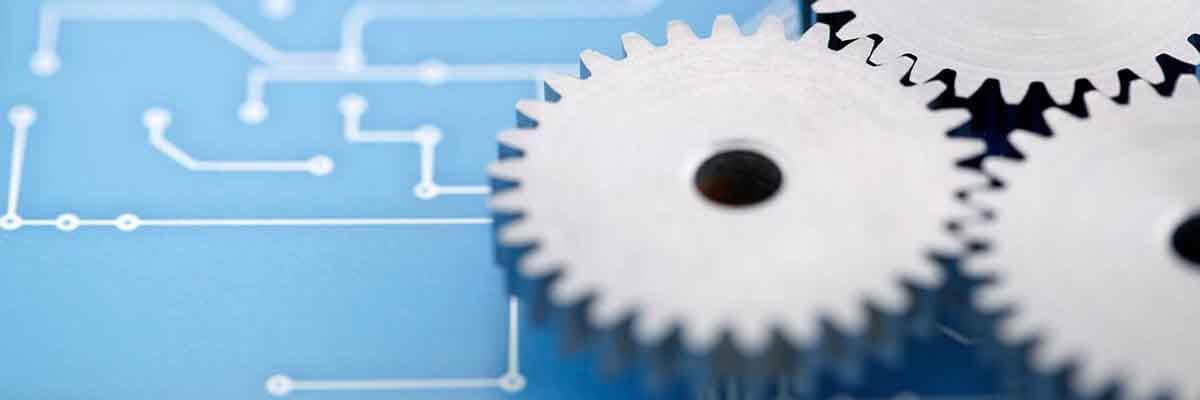 Abbildung von Zahnrädern, die auf einem Schaltplan liegen